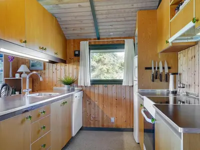 a kitchen with a sink and a window at Holiday Home Alfrik - 900m from the sea by Interhome in Blokhus