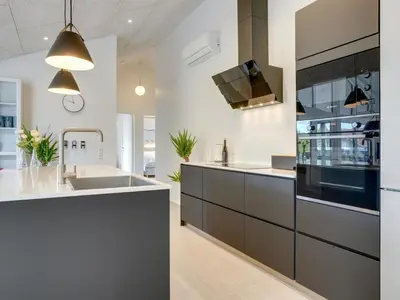 a kitchen with a sink and a stove at Holiday Home Antonina - 800m from the sea by Interhome in Blokhus