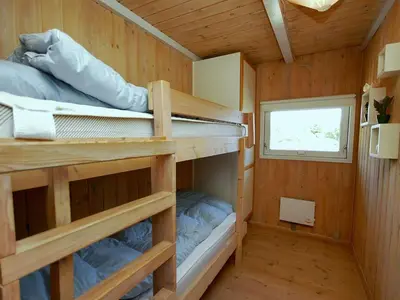 a small room with bunk beds in a tiny house at Holiday Home Anthonia - 1-6km from the sea by Interhome in Blokhus