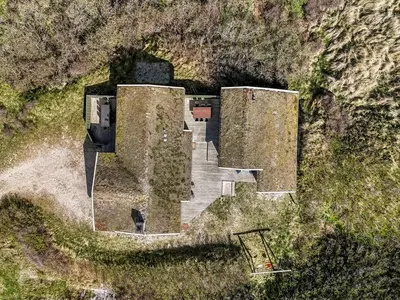 an aerial view of a building on a hill at Holiday Home Jobst - 150m from the sea by Interhome in Saltum