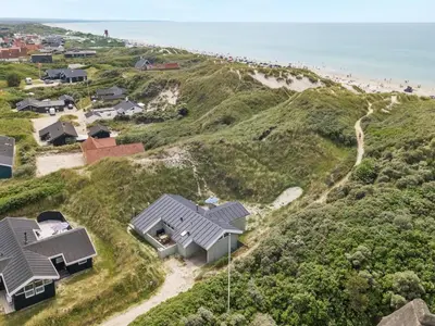 an aerial view of a house on a beach at Holiday Home Erwith - 50m from the sea by Interhome in Blokhus
