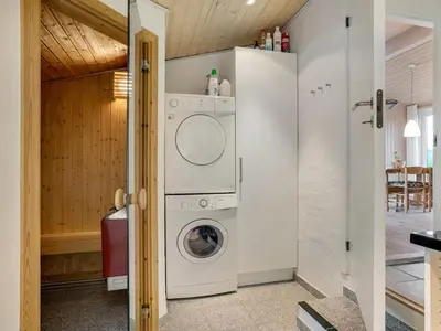 a laundry room with a washer and dryer at Holiday Home Josten - 500m from the sea by Interhome in Saltum
