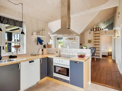 a kitchen with a sink and a stove top oven at Holiday Home Annemie - 1-8km from the sea by Interhome in Saltum