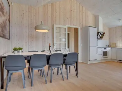 a large dining room with a table and chairs at Holiday Home Bentine - 1-6km from the sea by Interhome in Saltum