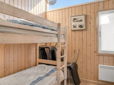 a bedroom with bunk beds in a cabin at Holiday Home Mechthild - 2-7km from the sea by Interhome in Saltum