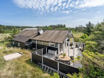 an aerial view of a house with a deck at Holiday Home Allida - 800m from the sea by Interhome in Saltum