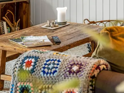 a wooden table with a wooden table with a wooden table at Holiday Home Ayelen - 600m from the sea by Interhome in Saltum