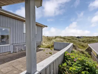 a porch of a house with a pillar at Holiday Home Kulle - 200m from the sea by Interhome in Saltum