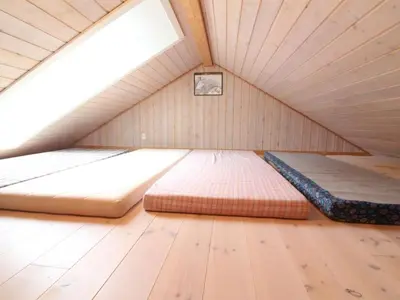 a room with two beds in a attic at Holiday Home Swen - 1-3km from the sea by Interhome in Saltum