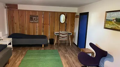 a room with a bed and a table and a chair at La Ola in Hanstholm