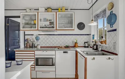 a kitchen with white cabinets and a sink at Awesome Home In Fjerritslev With Wifi in Fjerritslev