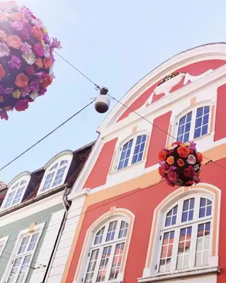 a red building with flowers in front of it at Skuespiller Centralen in Viborg