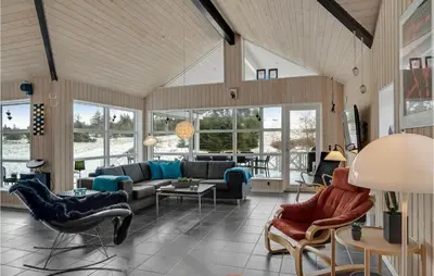 a living room with a couch and chairs at Nice Home In Fur With Sauna in Furland