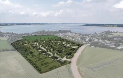 an aerial view of a large group of trees next to a lake at 4 Bedroom Beautiful Home In Løgstrup in Løgstrup