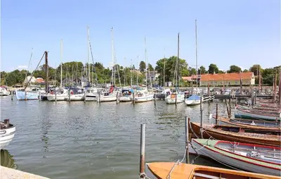 a bunch of boats are docked in a harbor at 4 Bedroom Beautiful Home In Løgstrup in Løgstrup