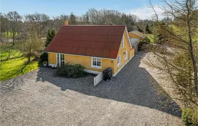 an overhead view of a yellow house with a red roof at Lovely Home In Pandrup With Wifi in Pandrup