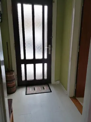 an open door in a room with a white floor at B&B Tvolm Ydby Thy in Tvolm