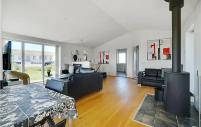 a living room with a wood stove in it at Lovely Home In Thisted With Kitchen in Thisted