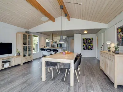 a kitchen and dining room with a table and chairs at Holiday Home Matilde - 400m to the fjord by Interhome in Struer