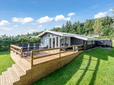 a modular home with a deck and lawn at Holiday Home Matilde - 400m to the fjord by Interhome in Struer