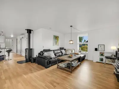 a living room with a couch and a table at Holiday Home Aleida - 100m to the fjord by Interhome in Vemb