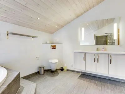 a bathroom with a toilet and a sink at Holiday Home Nani - 900m from the sea by Interhome in Torsted