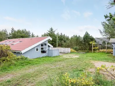 a house with solar panels on the roof at Holiday Home Biriel - 1km from the sea by Interhome in Thisted