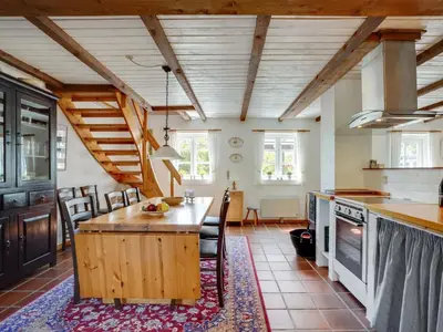a kitchen with a wooden island in a room at Holiday Home Minja - 900m from the sea by Interhome in Thisted