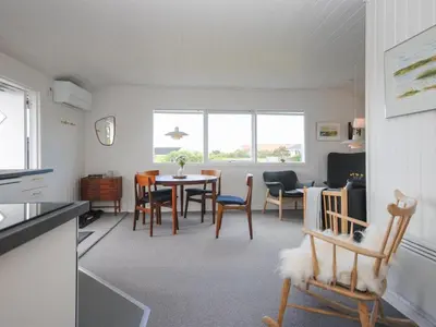 a kitchen and dining room with a table and chairs at Holiday Home Engelbertine - 900m from the sea by Interhome in Thisted