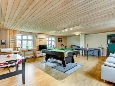 a living room with a pool table in it at Holiday Home Sophia - 8km from the sea by Interhome in Thisted