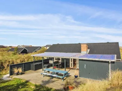 a house with a solarium on the roof at Holiday Home Madsen - 500m from the sea by Interhome in Thisted