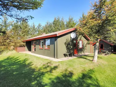 a green and red house with a yard at Holiday Home Neven - 900m from the sea by Interhome in Torsted