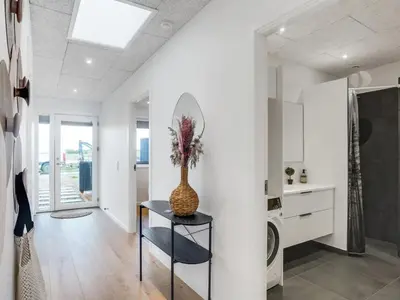 a hallway with a vase on a table in a house at Holiday Home Kasper - 1-8km from the sea by Interhome in Thisted