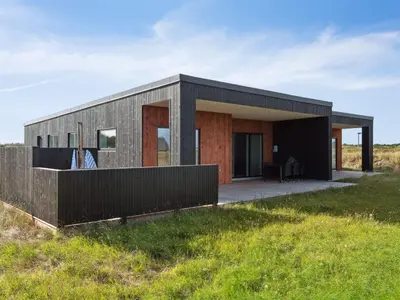 a small house on a hill with a fence at Holiday Home Kasper - 1-8km from the sea by Interhome in Thisted