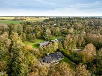 an aerial view of a house in the forest at Holiday Home Eisa - 300m to the fjord by Interhome in Øsløs
