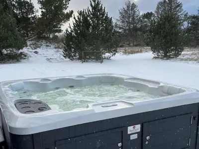 a jacuzzi tub in a snow covered yard at Holiday Home Gertrudis - 2km to the fjord by Interhome in Frøstrup