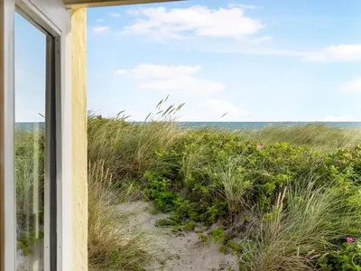 a window view of the beach from a beach house at Holiday Home Ebba - 25m from the sea by Interhome in Frøstrup