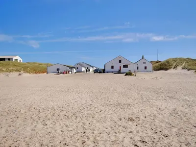 a group of houses on a sandy beach at Holiday Home Palle - 2km from the sea by Interhome in Snedsted