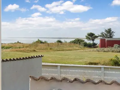 a view of the ocean from a house at Apartment Hubertine - 100m to the fjord by Interhome in Vestervig