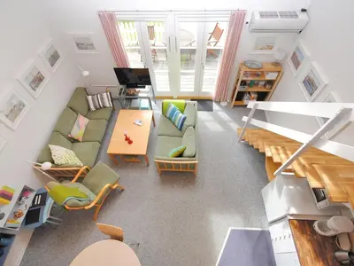 a living room with a couch and a table at Apartment Stelle - 100m to the fjord by Interhome in Vestervig