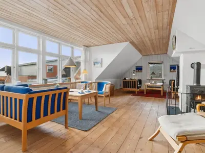 a large living room with a wooden ceiling at Holiday Home Gertina - 40m to the fjord by Interhome in Vestervig