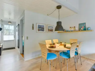 a dining room with a table and chairs at Apartment Cita - 100m to the fjord by Interhome in Vestervig
