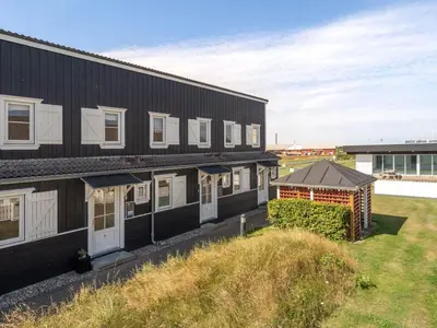 an aerial view of a black building with a yard at Apartment Idunn - 100m to the fjord by Interhome in Vestervig