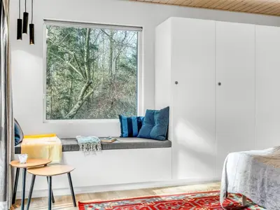 a living room with a window and a couch at Holiday Home Milan - 250m to the fjord by Interhome in Thyholm
