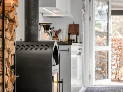 an oven in a kitchen with a window at Holiday Home Milan - 250m to the fjord by Interhome in Thyholm