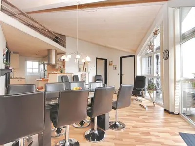 a dining room with a table and chairs at Holiday Home Eberta - 200m to the fjord by Interhome in Vinderup