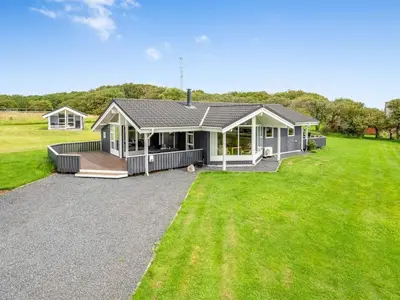 a home with a large yard with a house at Holiday Home Lucio - 350m to the fjord by Interhome in Vinderup