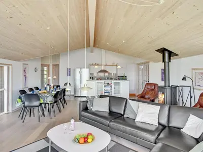 a living room with a couch and a table at Holiday Home Guthmar - 350m to the fjord by Interhome in Vinderup