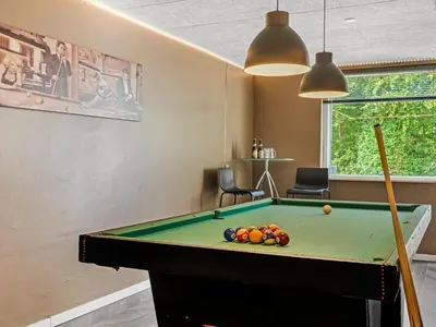 a room with a pool table in a room at Holiday Home Gudfast - 300m to the fjord by Interhome in Thyholm
