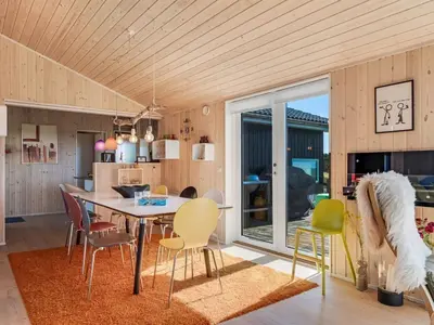 a dining room with a table and chairs at Holiday Home Ginia - 150m to the fjord by Interhome in Vinderup